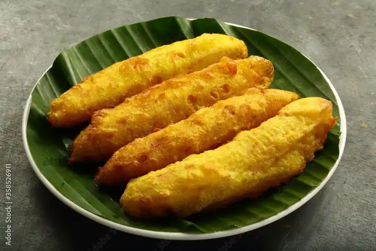 Fried bananas on banana leaf plate